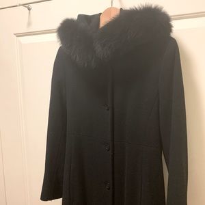 Elegant long Searle wool coat with faux fur hood.